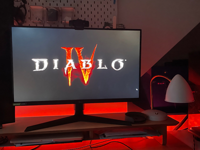 Diablo IV being played on a computer lit from behind with a red LED light strip.